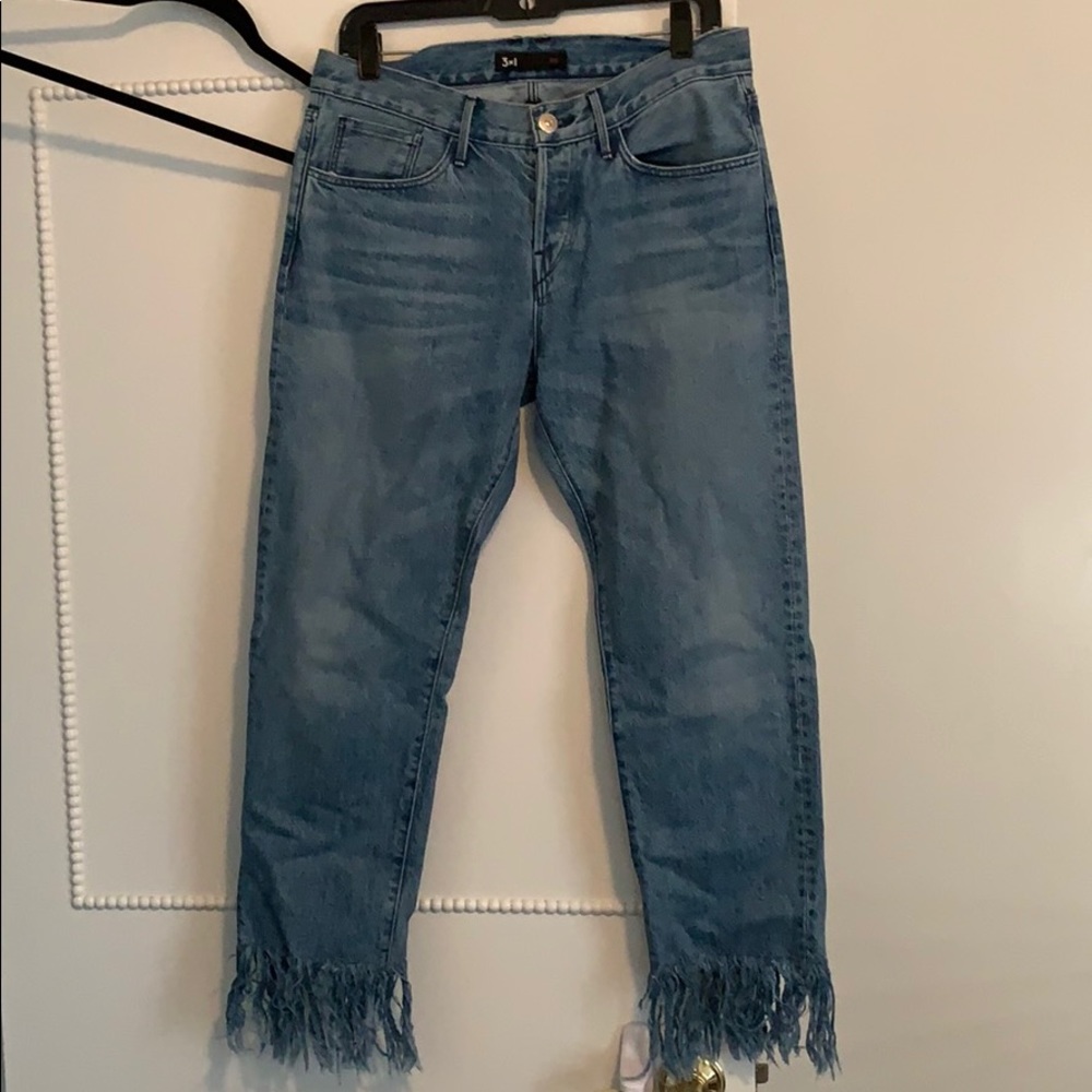 Blue jeans with frayed detail